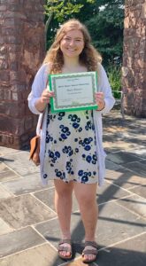 Young woman holding certificate